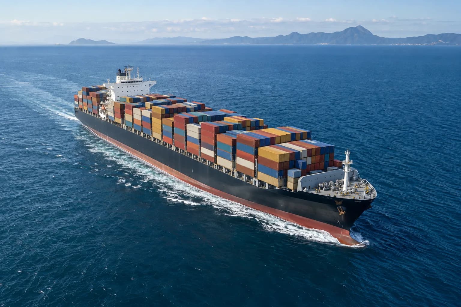 Loaded container vessel transporting freight at sea